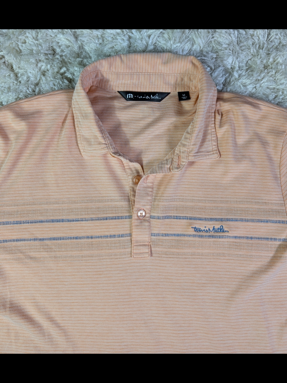 Travis Mathew Peach Polo with Blue Stripe Accents